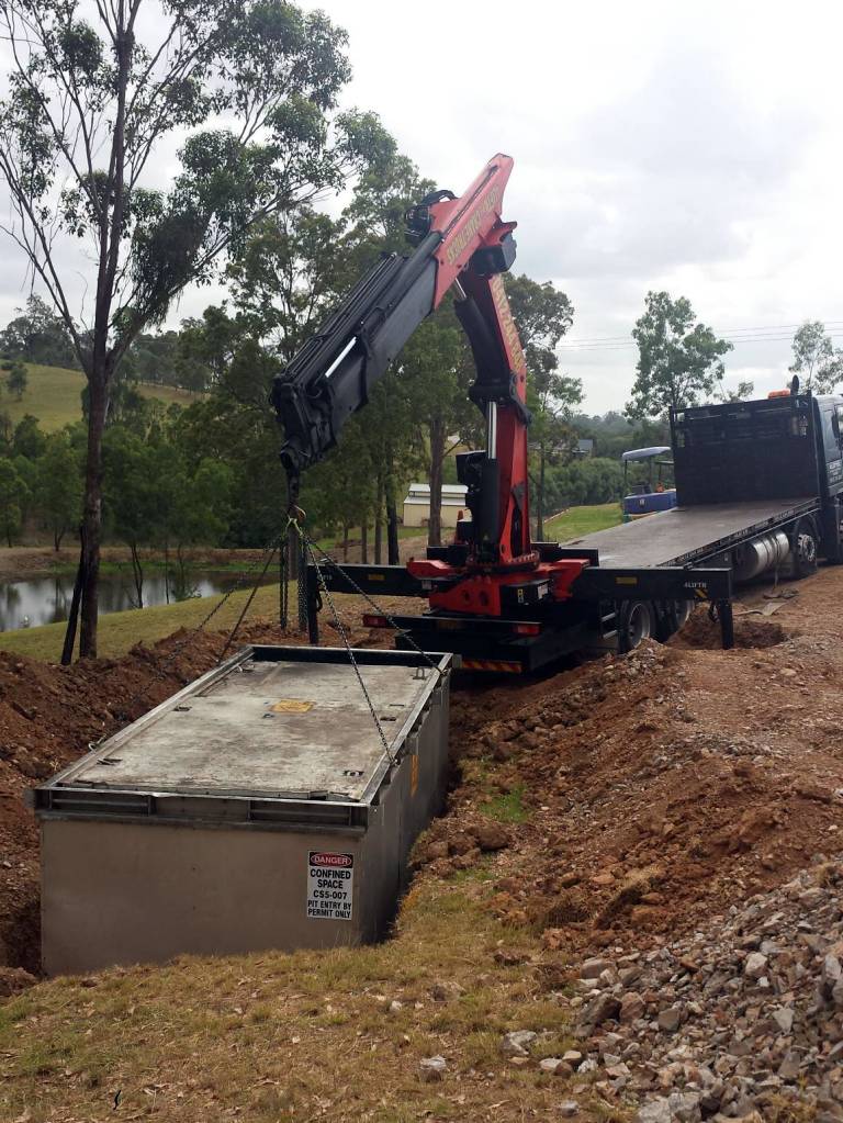 HIAB truck delivering cement shed