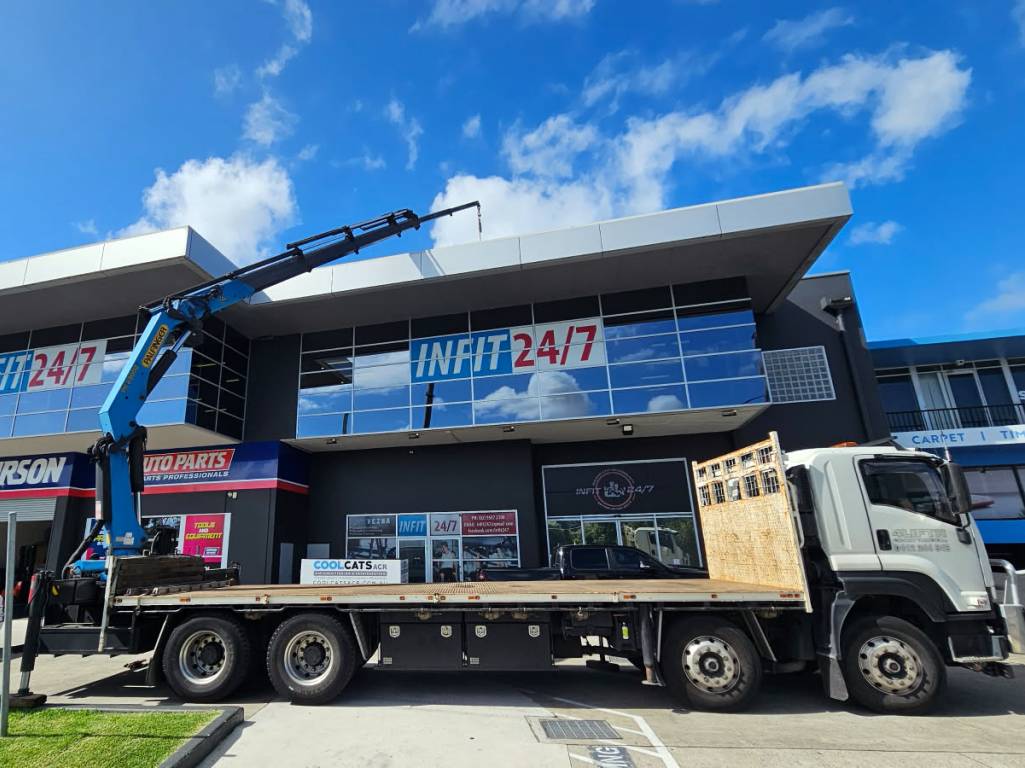 HIAB truck lift air conditioner to roof - Infit247 building